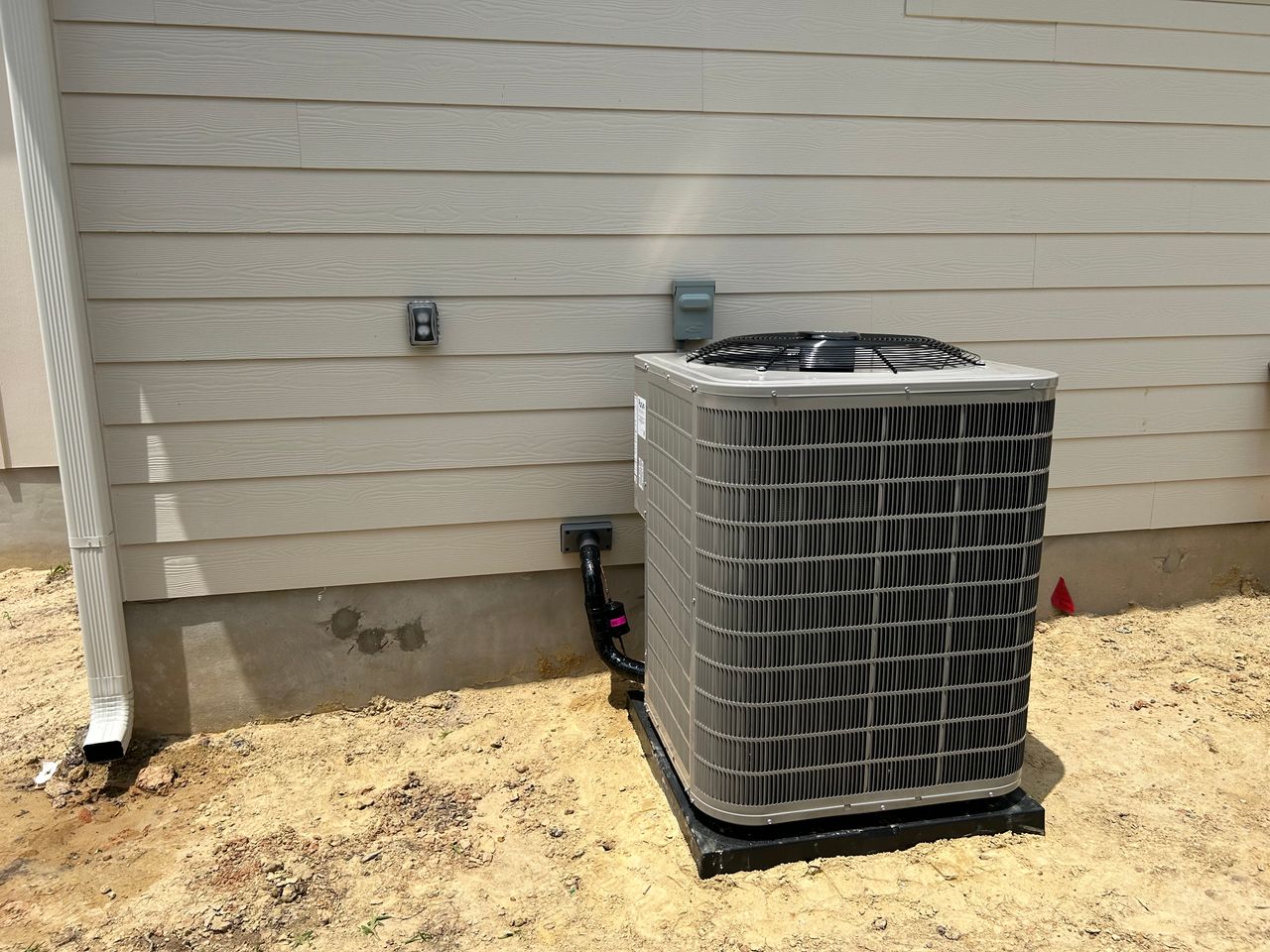 New residential AC condenser unit installation
