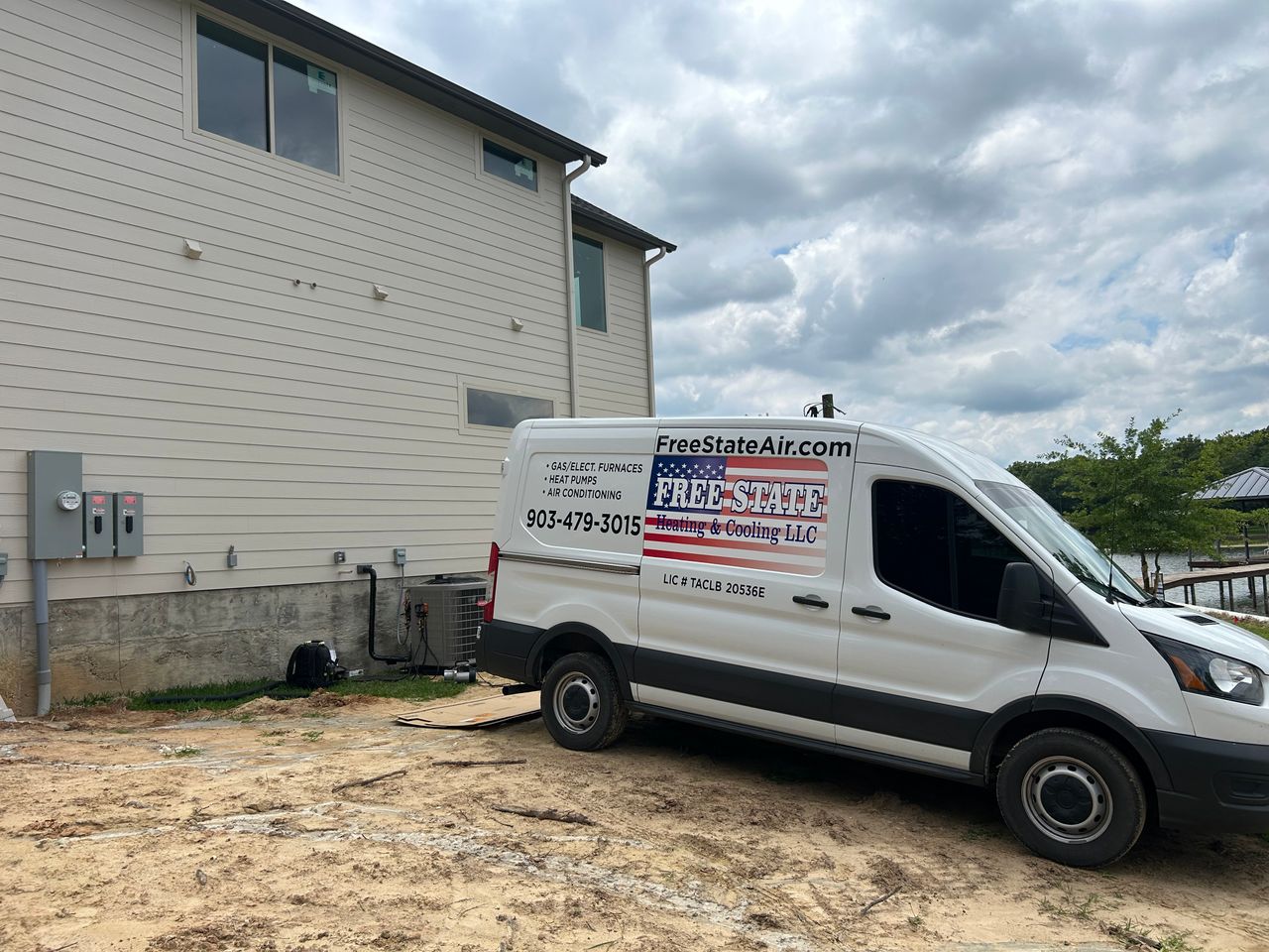 Free State Heating and Cooling van parked next to new HVAC unit install