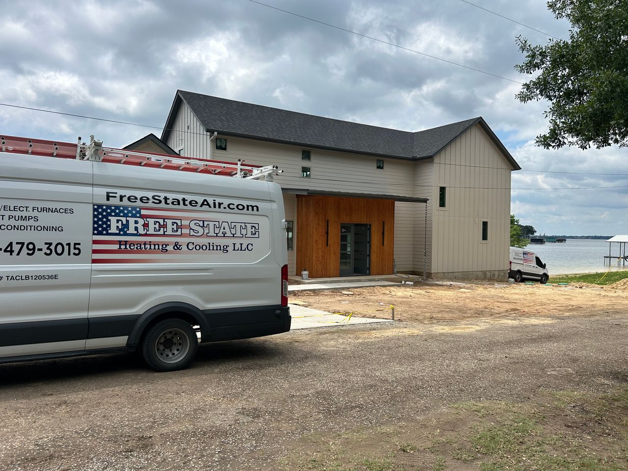 Free State Heating and Cooling van at a lakeside home installation